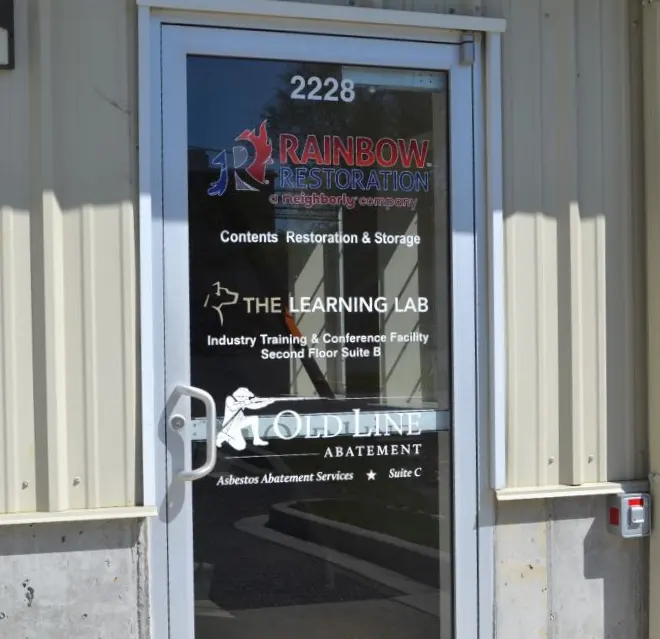 The entrance door to Rainbow Restoration of Northeastern Maryland's office building at 2228.