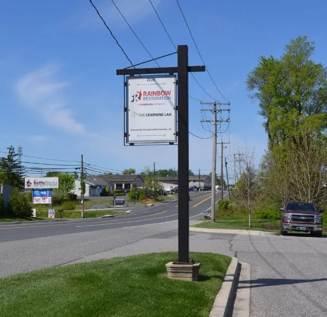 The Rainbow Restoration of Northeastern Maryland roadside sign at their 2228 headquarters location.