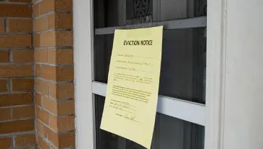 Eviction notice taped to front door.