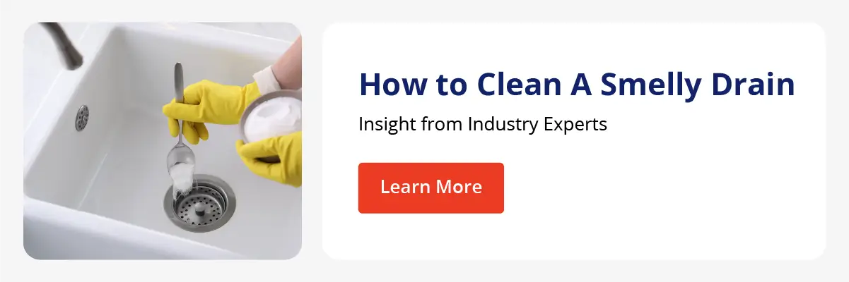 CTA to a post about how to clean a smelly sink drain with a photo of someone pouring a baking soda mixture down a kitchen drain.